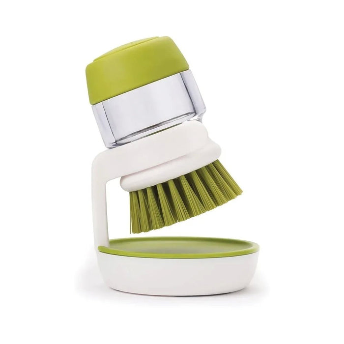 Brush with dispenser for dishes