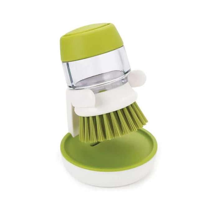 Brush with dispenser for dishes