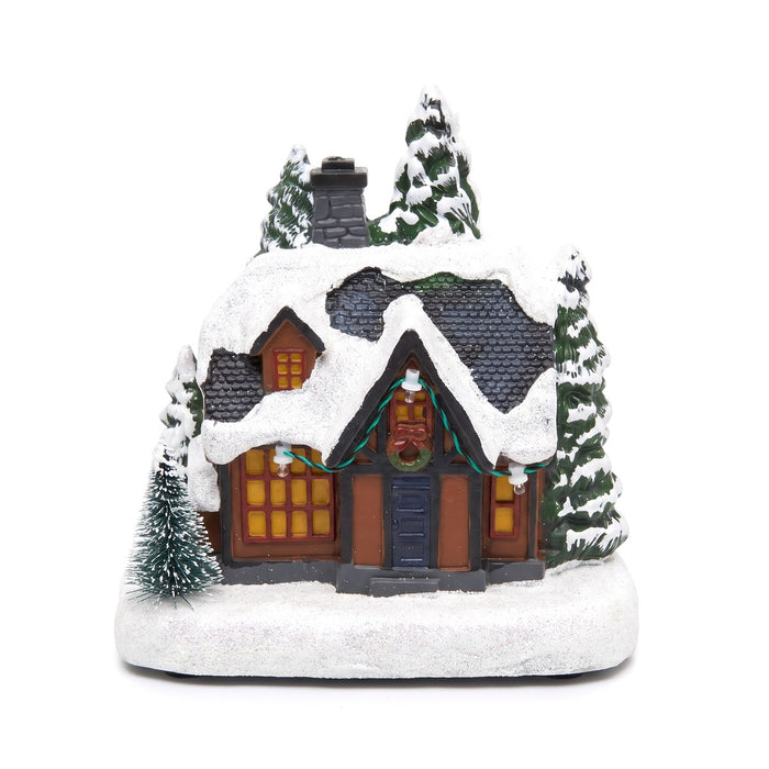 Casetta natalizia innevata con luci LED